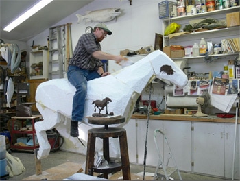 carving styrofoam core for horse sculpture