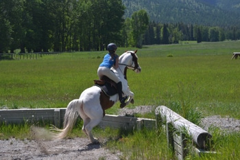 Cortnee jumping her horse